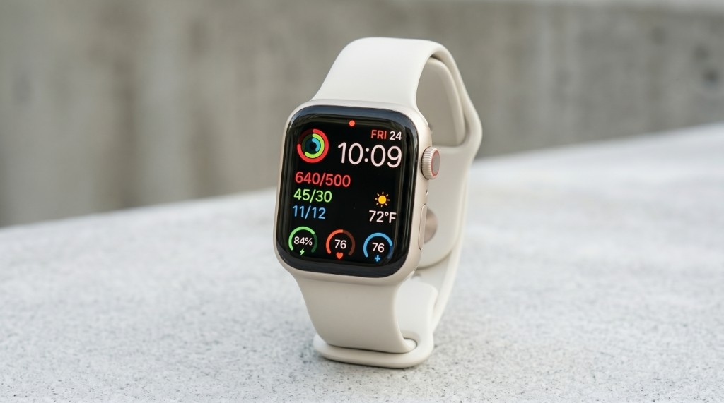 Apple Watch showing activity and health metrics on the display